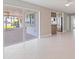 Spacious living room area with tile floors and beautiful views of the outdoor patio and water at 11055 7Th E St, Treasure Island, FL 33706