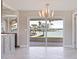 View from living room sliding glass doors to screened-in patio and waterfront at 11055 7Th E St, Treasure Island, FL 33706