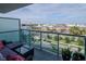A relaxing condo balcony overlooking the city, street, and nearby harbor at 111 N 12Th St # 1707, Tampa, FL 33602