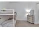 Bunk bedroom with white bunkbeds and a gray dresser with a mirror at 111 N 12Th St # 1707, Tampa, FL 33602