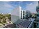 A condominium building featuring a shared pool and balcony views of the city and nearby harbor at 111 N 12Th St # 1707, Tampa, FL 33602