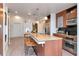 Contemporary kitchen features granite countertops, stainless steel appliances, and an open layout with bar seating at 111 N 12Th St # 1707, Tampa, FL 33602