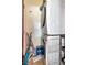 Laundry area with stacked washer and dryer and lots of cleaning supplies at 111 N 12Th St # 1707, Tampa, FL 33602