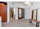Bright living space with sleek flooring, modern fixtures, and access to the bathroom and walk-in closet at 111 N 12Th St # 1707, Tampa, FL 33602