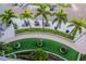 Overhead view of a patio featuring palm trees, outdoor dining tables, and artificial turf at 111 N 12Th St # 1707, Tampa, FL 33602
