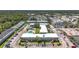 Wonderful aerial view of complex with a swimming pool and well manicured landscaping at 1433 S Belcher Rd # B11, Clearwater, FL 33764