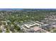 Panoramic aerial view of the neighborhood with mature trees, and surrounding buildings at 1433 S Belcher Rd # B11, Clearwater, FL 33764