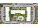 Aerial of the complex featuring a community pool, green spaces, and ample parking for residents at 1433 S Belcher Rd # B11, Clearwater, FL 33764