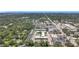 High definition aerial view of the neighborhood with lush trees and the condo complex at 1433 S Belcher Rd # B11, Clearwater, FL 33764