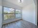 Cozy bedroom features modern flooring, natural light, and neutral paint, creating a serene atmosphere at 1433 S Belcher Rd # B11, Clearwater, FL 33764