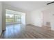Inviting living room with large windows, modern flooring, and neutral paint, offering a bright and airy space at 1433 S Belcher Rd # B11, Clearwater, FL 33764