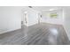 Spacious living room features modern flooring, fresh paint, and bright lighting at 1433 S Belcher Rd # B11, Clearwater, FL 33764