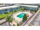 Overhead view of a well-kept community pool, surrounded by lounge chairs and manicured landscaping at 1433 S Belcher Rd # B11, Clearwater, FL 33764