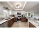 Modern kitchen featuring stainless steel appliances and granite countertops with open floor plan at 15525 Old Dixie Hwy, Hudson, FL 34667