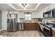 Beautiful kitchen with stainless appliances, granite counters, and ample cabinet space at 15525 Old Dixie Hwy, Hudson, FL 34667