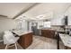Well-equipped kitchen with granite countertops and stainless steel appliances near eating area at 15525 Old Dixie Hwy, Hudson, FL 34667