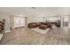 Spacious living room with wood-look flooring, perfect for entertaining and relaxing at 15525 Old Dixie Hwy, Hudson, FL 34667