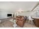 Inviting living room with ample seating and stylish décor with easy access to kitchen at 15525 Old Dixie Hwy, Hudson, FL 34667