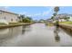 A scenic canal view with boats docked along the tranquil waterfront property, showcasing the serene and peaceful living environment at 15525 Old Dixie Hwy, Hudson, FL 34667