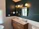 Modern bathroom with double vanity, stylish lighting, and beautiful tile accents at 1601 14Th N St, St Petersburg, FL 33704