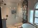 Luxurious bathroom featuring a glass-enclosed shower and freestanding tub at 1601 14Th N St, St Petersburg, FL 33704
