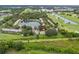 Panoramic aerial view showcasing the community's beautiful lake and golf course views at 1724 Adams S Cir, Largo, FL 33771