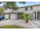 Charming townhome featuring a well-maintained front yard and inviting entryway at 1724 Adams S Cir, Largo, FL 33771