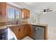 Charming kitchen featuring granite countertops, stainless steel appliances, and ample cabinet space at 1724 Adams S Cir, Largo, FL 33771