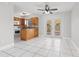 Well-lit kitchen with granite countertops, wood cabinets, and stainless-steel appliances at 1724 Adams S Cir, Largo, FL 33771
