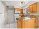 Cozy kitchen featuring granite countertops and white appliances at 1724 Adams S Cir, Largo, FL 33771