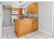 Practical kitchen with granite countertops, white appliances, and ample cabinet space at 1724 Adams S Cir, Largo, FL 33771