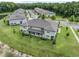 A serene backyard features lush green space and a scenic view of surrounding homes and neighborhood at 17482 Nectar Flume Dr, Land O Lakes, FL 34638