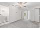Bright, open bedroom with closet, laundry room, and ceiling fan at 17482 Nectar Flume Dr, Land O Lakes, FL 34638