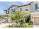Charming townhome exterior with lush landscaping and a well-maintained facade at 17482 Nectar Flume Dr, Land O Lakes, FL 34638