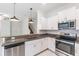 Well-lit kitchen with stainless steel appliances and granite countertops at 17482 Nectar Flume Dr, Land O Lakes, FL 34638