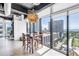 Bright dining area with large windows, city views, modern chandelier, and seating for six at 175 2Nd St S # P-2, St Petersburg, FL 33701
