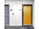 Hallway with light wood door and gray trim, along with gray stairwell door at 175 2Nd St S # P-2, St Petersburg, FL 33701