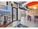 Spacious open-concept living space with exposed ductwork, brick accent walls, and floor-to-ceiling city views at 175 2Nd St S # P-2, St Petersburg, FL 33701