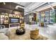 Well-lit lobby with display shelving, bar area, modern seating, and large windows at 175 2Nd St S # P-2, St Petersburg, FL 33701