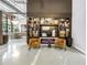 Lobby space with fireplace, display shelving, and comfortable seating at 175 2Nd St S # P-2, St Petersburg, FL 33701
