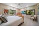 Bright bedroom featuring tiled floors, a large window, and a chest of drawers at 1835 Alicia Way, Clearwater, FL 33764