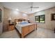 Comfortable bedroom with a window view, wooden bed and side tables at 1835 Alicia Way, Clearwater, FL 33764
