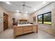 Comfortable bedroom with a view of the trees outside and wooden furniture at 1835 Alicia Way, Clearwater, FL 33764