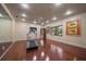 Spacious exercise room with hardwood floors, recessed lighting, and a treadmill at 1835 Alicia Way, Clearwater, FL 33764