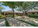 Impressive home exterior with well-manicured landscaping, mature trees, and a spacious driveway at 1835 Alicia Way, Clearwater, FL 33764