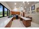 Bright home office with a large window, built-in storage and counter workspace at 1835 Alicia Way, Clearwater, FL 33764