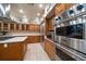 Well-equipped kitchen with stainless steel Viking appliances and wood cabinetry at 1835 Alicia Way, Clearwater, FL 33764