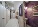 Laundry area with adjacent powder room, washer/dryer, and hallway storage at 1835 Alicia Way, Clearwater, FL 33764