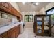 Bright laundry room with a sink, washer, dryer and storage cabinets at 1835 Alicia Way, Clearwater, FL 33764