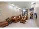 Comfortable living room with leather sofa, matching armchair, and tiled flooring at 1835 Alicia Way, Clearwater, FL 33764